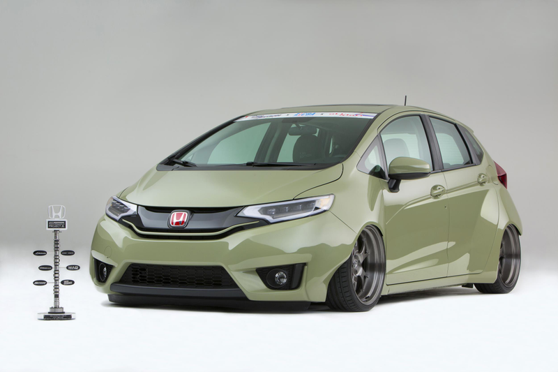 Illustration for article titled A Honda Fit With A Grom In The Back Is Something We Need Yesterday